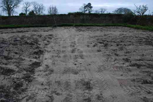 After rotavating the area was spread with coarse sand and then mushroom compost