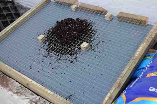 Filling the frame with compost